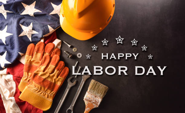 istock Happy Labor day concept. American flag with different construction tools and the text on dark stone background. 1405337299