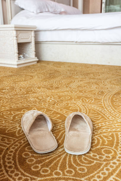 istock Cotton slippers on carpet 1405338286