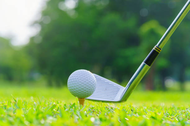 istock Golf ball on green grass ready to be struck on golf course 1405338393