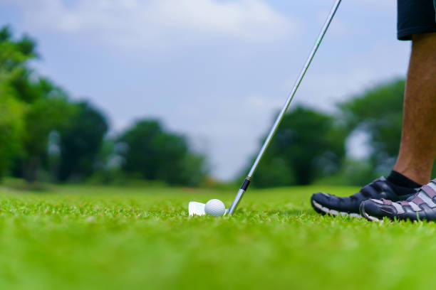 istock Golf ball on green grass ready to be struck on golf course 1405338408