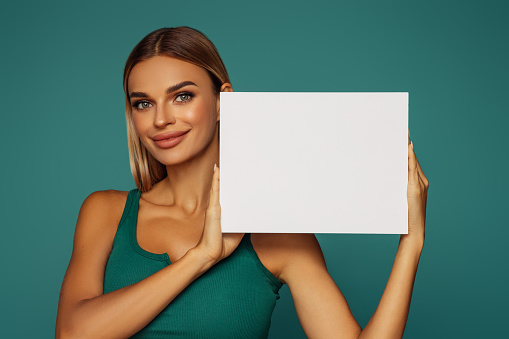 Excited Blond Woman Is Holding Placard