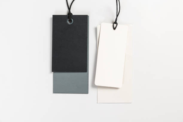 istock two fashionable blank labels for clothes on a gray background 1405344625