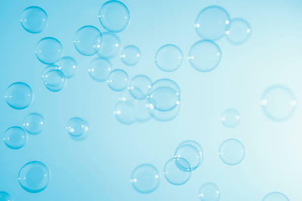 istock Abstract Beautiful Transparent Blue Soap Bubbles Background. Soap Sud Bubbles Water 1405348064