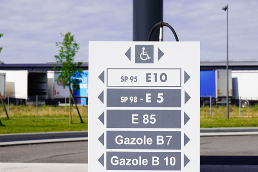 Modern panel road sign text filling station in france
