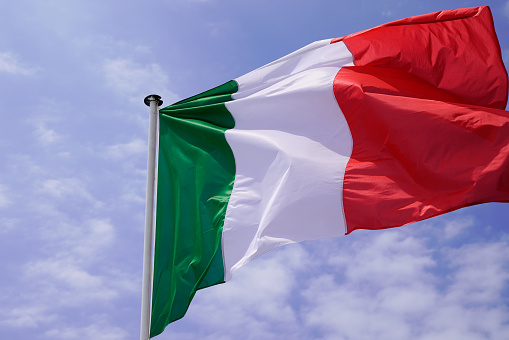 italia flag italian National state flag on wind mat with blue cloud summer sky