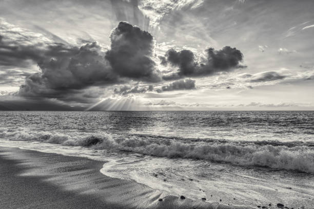 istock Ocean Sunset Nature Sun Rays Breaking Through Clouds Black And White 1405351978
