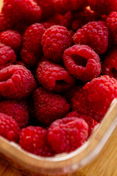 istock Close up fresh raspberries on the table 1405354270