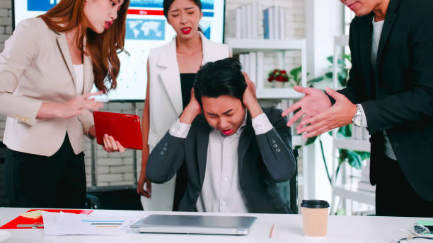 istock Employee having trouble with deadlines on assignments. Businessman is feeling stressed when coworkers rush to finish work. 1405356765