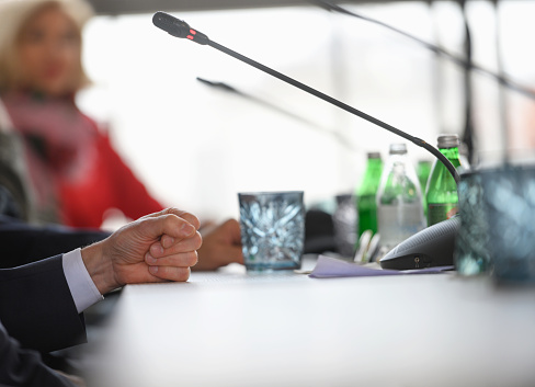 Close-up of businessman gesturing while speaking at conference, Nikon Z7