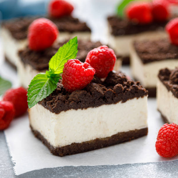 istock Chocolate cube cake, sliced brownie cheesecake with fresh raspberry 1405357696