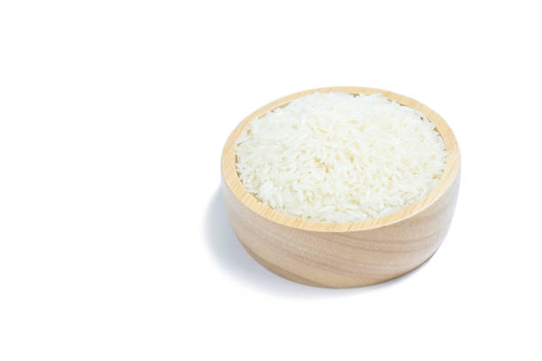 istock Thai jasmine rice in wooden cup on white background. 1405360706