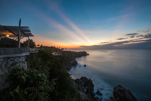 Sunset over Indian Ocean viewpoint in Uluwatu, Bali, Indonesia