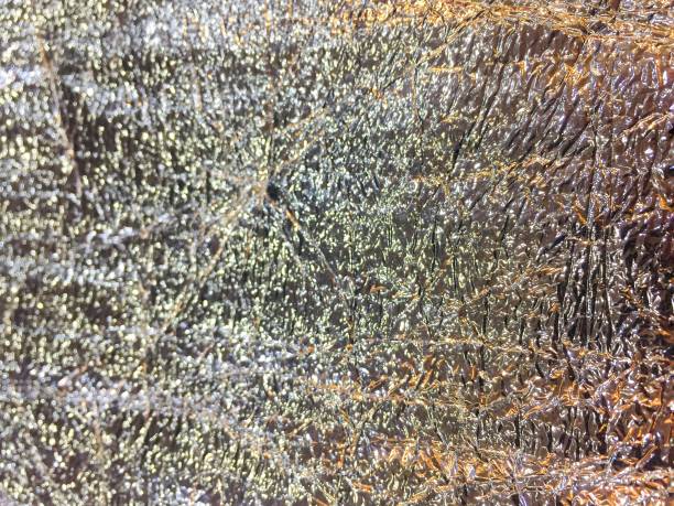 istock Shine and  glowing aluminum foil with surface texture for background. 1405362424