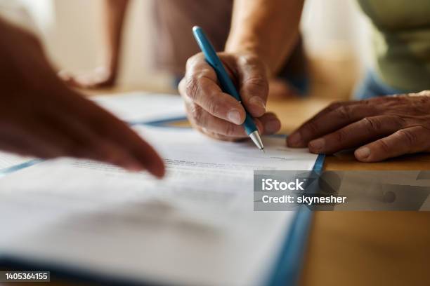 Signing A Contract Stock Photo - Download Image Now - Signing, Senior Adult, Contract