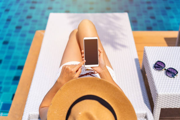 istock Young woman traveler using phone while traveling on summer vacation 1405364174