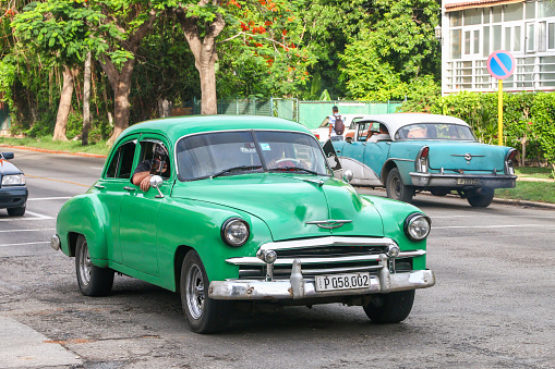 Havana, Cuba - June 6, 2017: Green retro car Chevrolet Deluxe in the city street.
