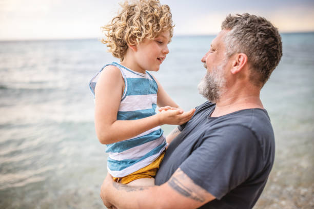istock Father and son on the beach 1405365456