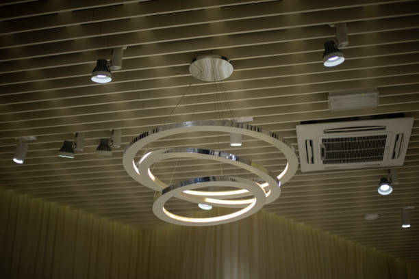 istock Lamp on ceiling. Designer lighting fixture. Lamps in building. 1405367446