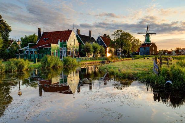 istock Netherlands windmills at sunset, landscape. 1405368427