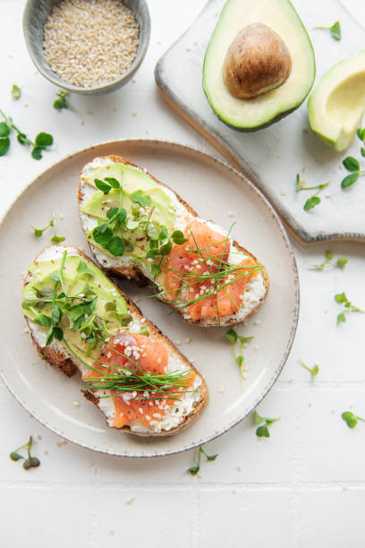 istock Sandwiches with salted salmon,  avocado and microgreens. 1405370506