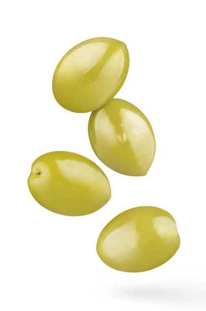 istock Flying delicious olives on white 1405371244