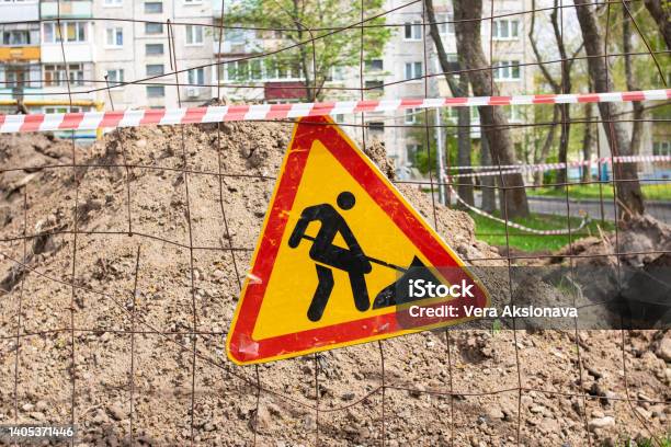 Roadworks Under Construction Earthwork Sign On Fence Stock Photo - Download Image Now