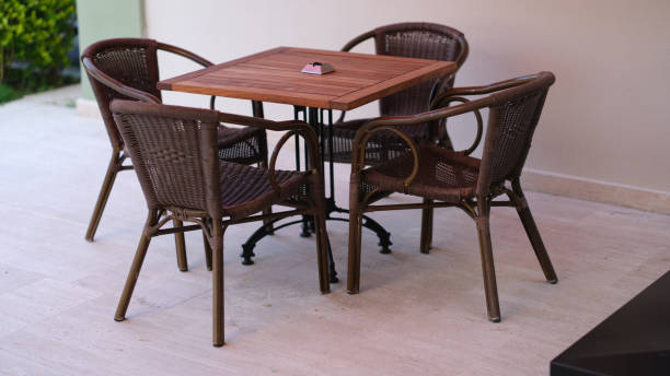 istock Wooden table with chairs standing on summer terrace 1405373434