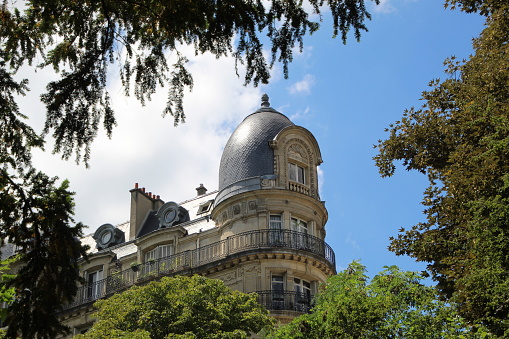 French building with trees