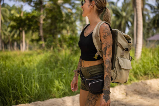 Side-view of urban young Caucasian female tourist travel alone