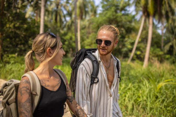istock Couple travel together, while using mobile phone 1405377618
