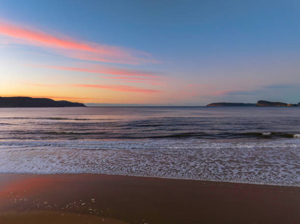 istock Gentle sunrise seascape with light scattered high cloud 1405377627