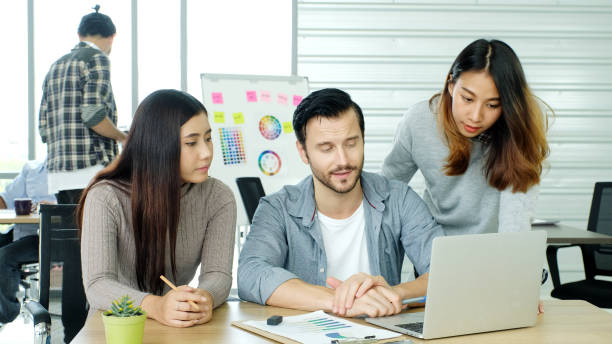 istock Creative team discussing about work at office, Small business teamwork planing business strategy, office life 1405380373