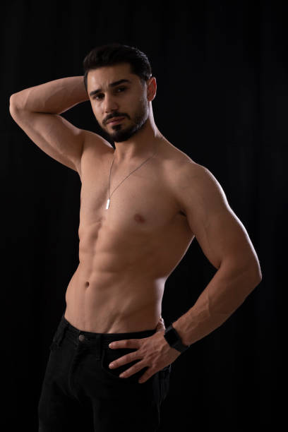 istock Handsome young muscular man in the studio 1405383432