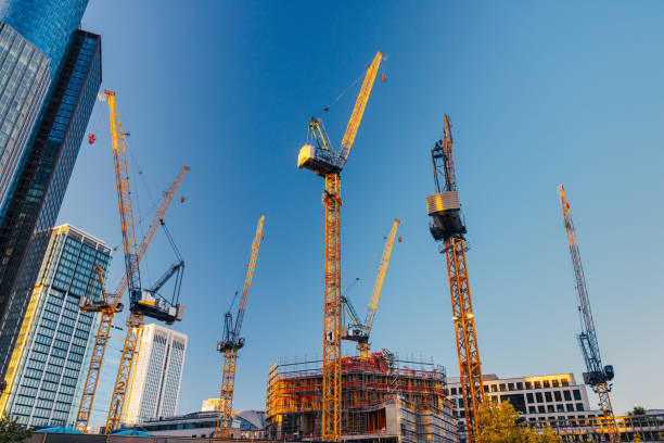 istock Growing financial district in Frankfurt am Main with tall construction machinery 1405383583