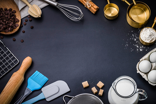 Cooking utensils and pastry ingredients with copy space