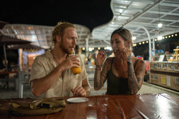 istock Caucasian couple exploring the night market 1405385003