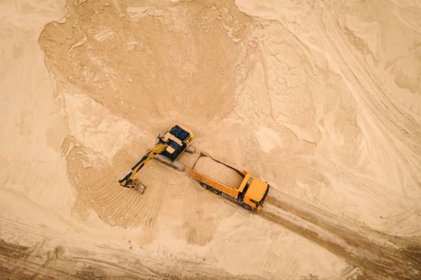 istock Excavator loading sand into truck in opencast sand quarry 1405385966