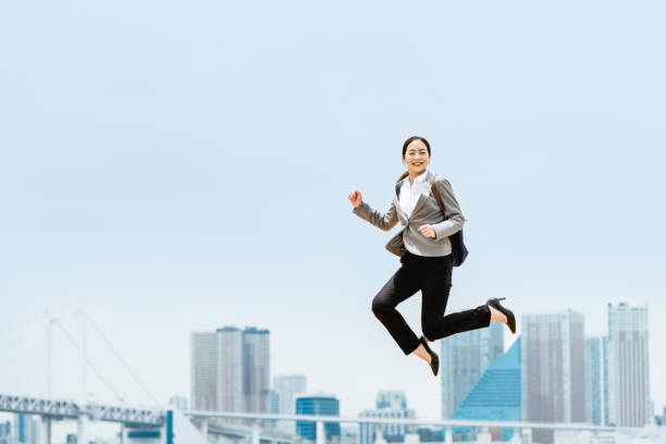 istock The image of an active woman (business, jump, success) 1405386122