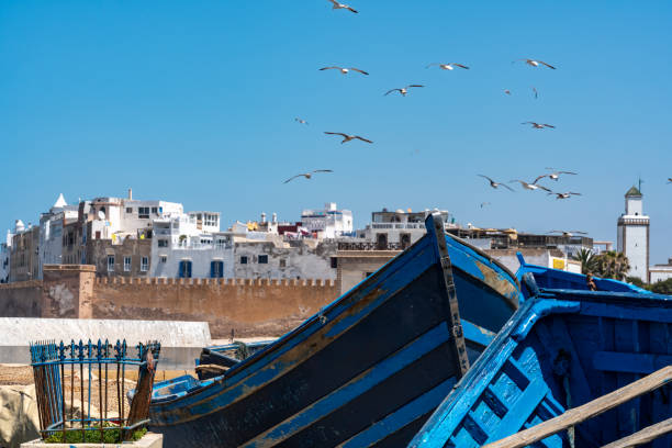istock Old boats on the harbour wall 1405387675