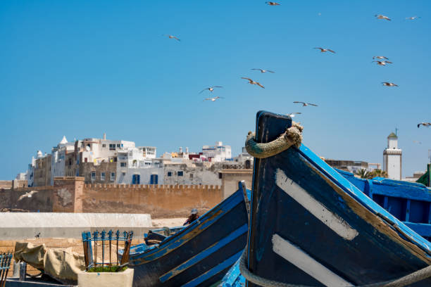 istock Old boats on the harbour wall 1405387743