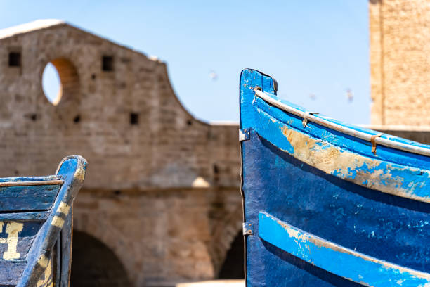 Old boats on the harbour wall