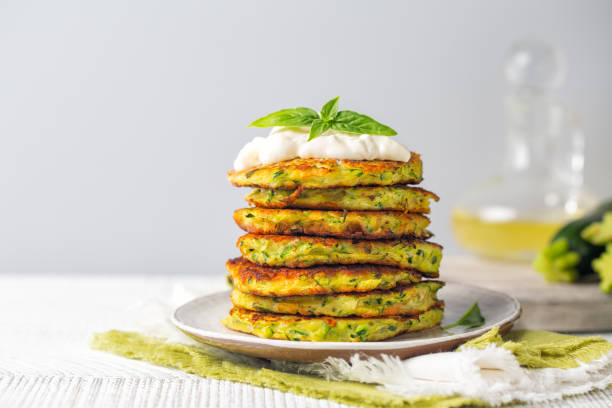 istock A stack of zucchini fritters served with basil and soft cheese. Copy space. 1405390220
