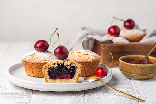Homemade mini pies with cherry and blackcurrant feeling. White background, selective focus, copy space.
