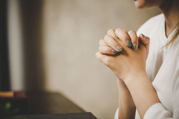 istock A woman praying worship believe 1405391805