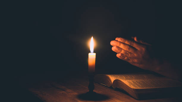istock Woman hands praying on holy bible 1405391949