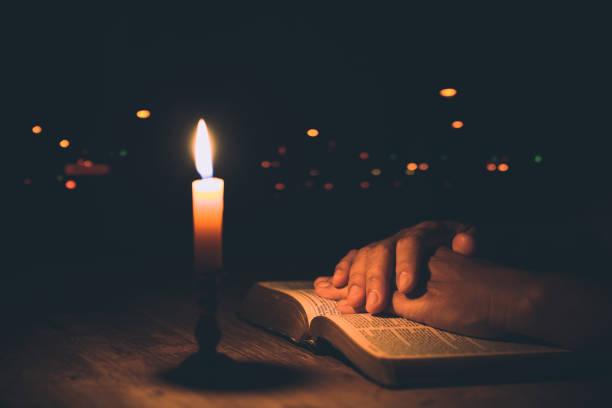 istock Woman hands praying on holy bible 1405392756