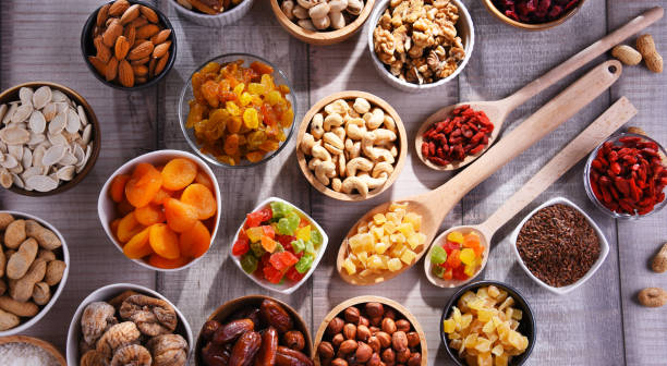 istock Composition with dried fruits and assorted nuts. Delicacies 1405392823