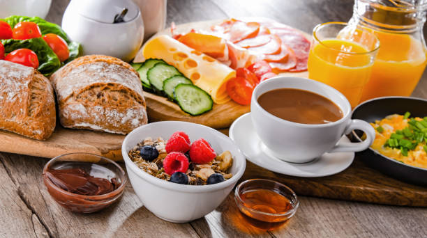 istock Breakfast served with coffee, scrambled eggs, cereals and ham 1405394381