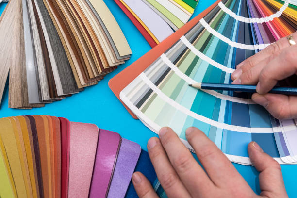 istock male hand choosing paint tone at color sampler isolated 1405395452