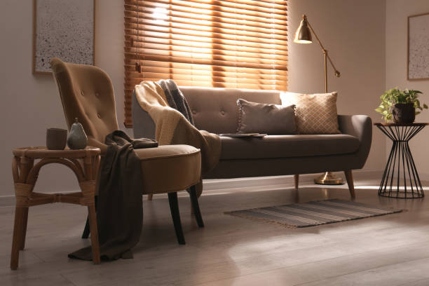 istock Stylish living room interior with comfortable armchair and sofa 1405395930